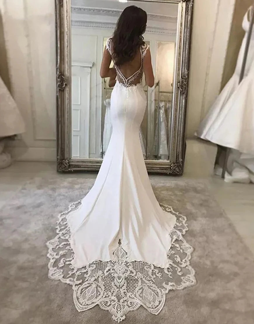 Previous product Next product Satin Mermaid Lace V-neck Cap Sleeves Wedding Dress With Appliques
